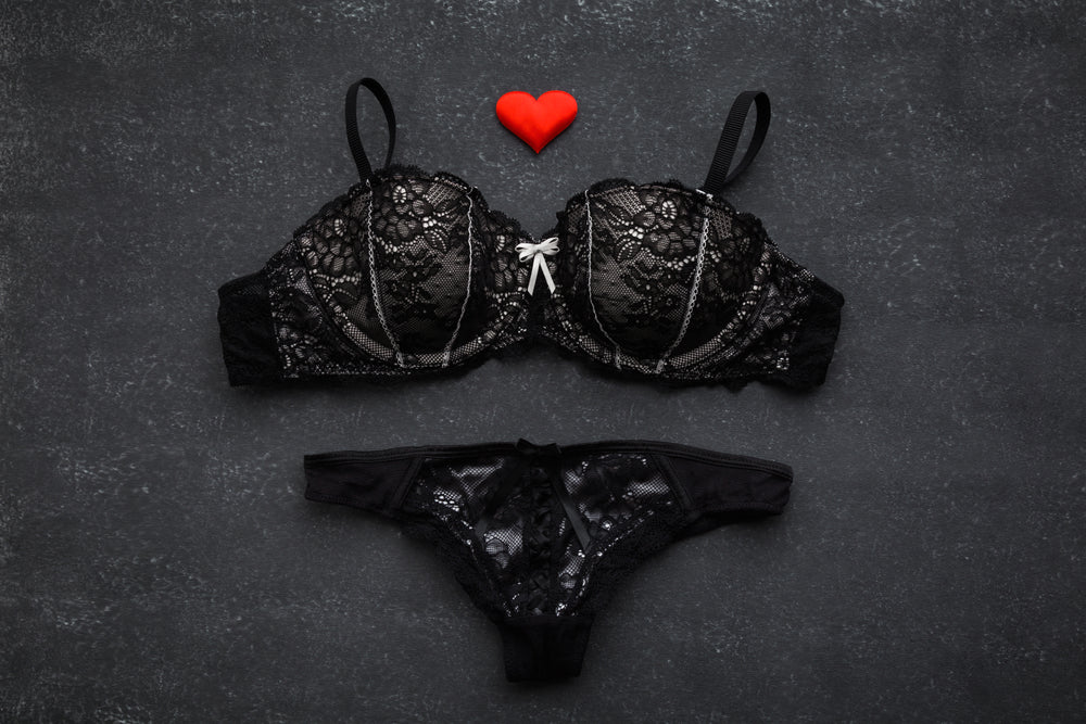 Elegant black lace bra and pantie set with heart accent, perfect for intimate wear. Shop bras and panties at Trending Chic in New Zealand